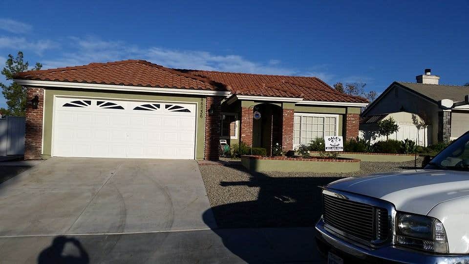 Completed residential exterior with brick and painted siding