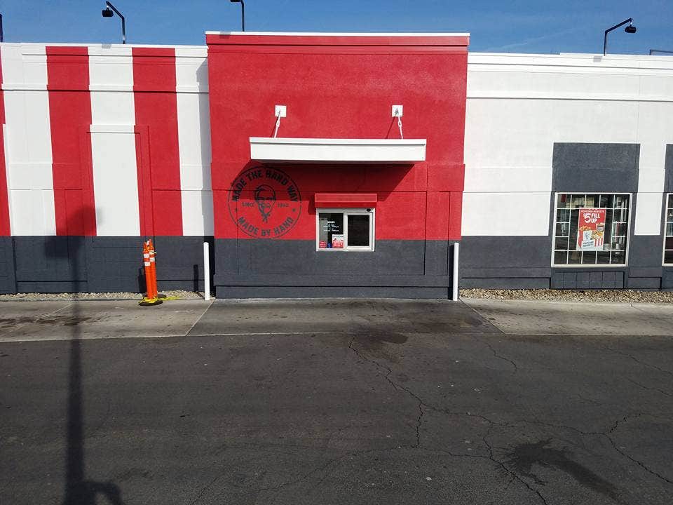 KFC commercial exterior painted in red, white, and charcoal