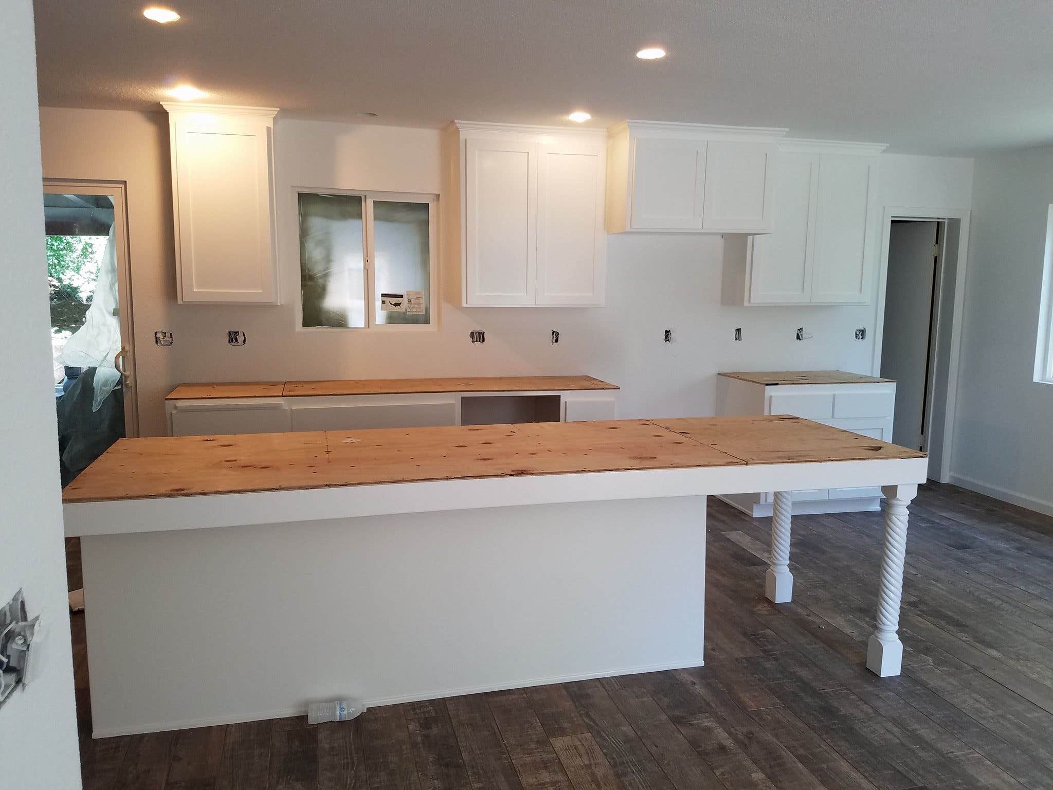 Kitchen cabinets refinished in a smooth bright white