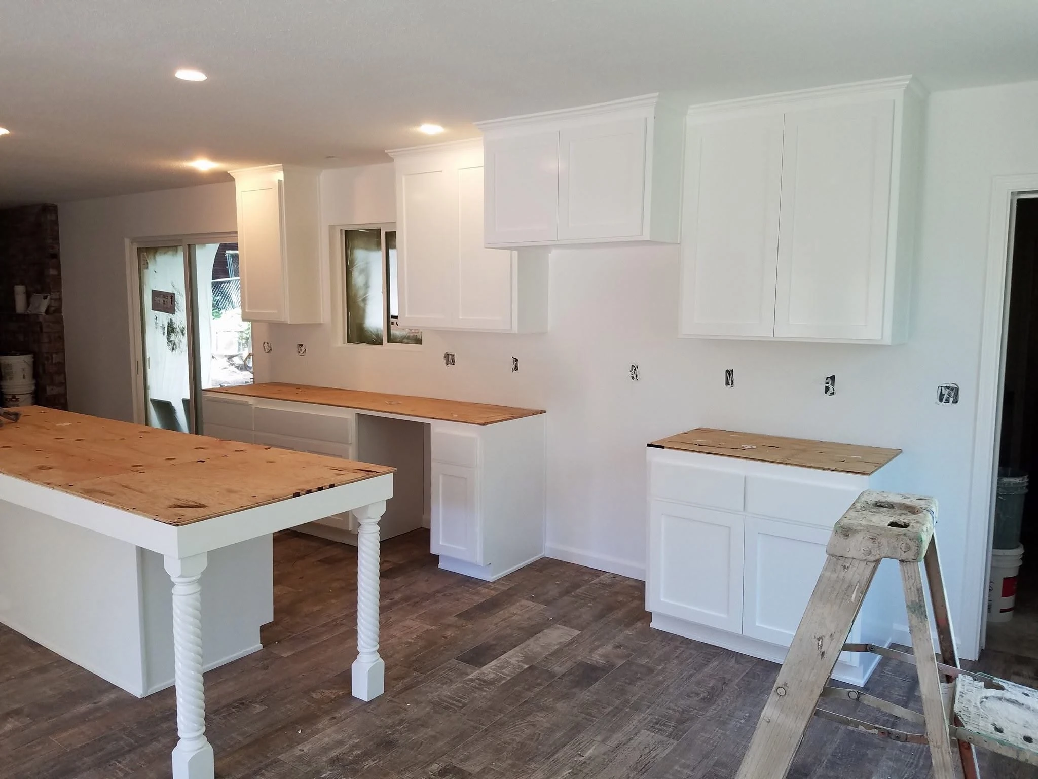 Kitchen cabinets after a bright white painted finish